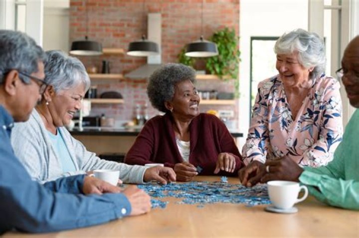 a group of seniors playing games together Giving Care by Silvert's