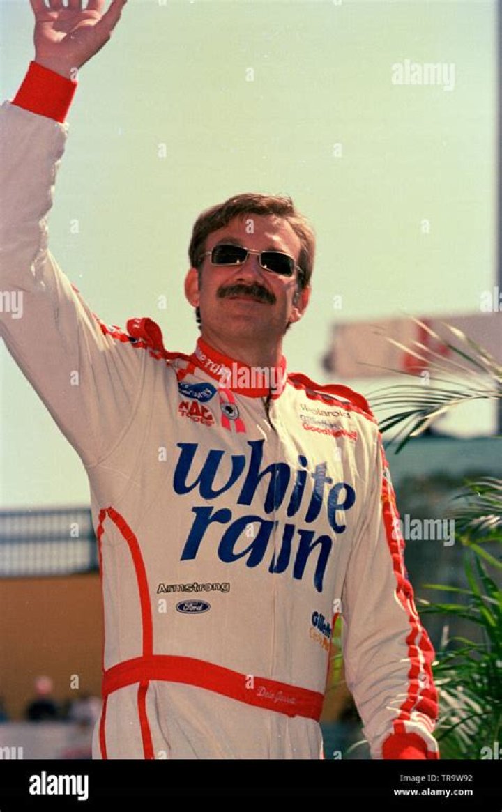 Dale Jarrett on pit road with his wife at Darlington Raceway at the