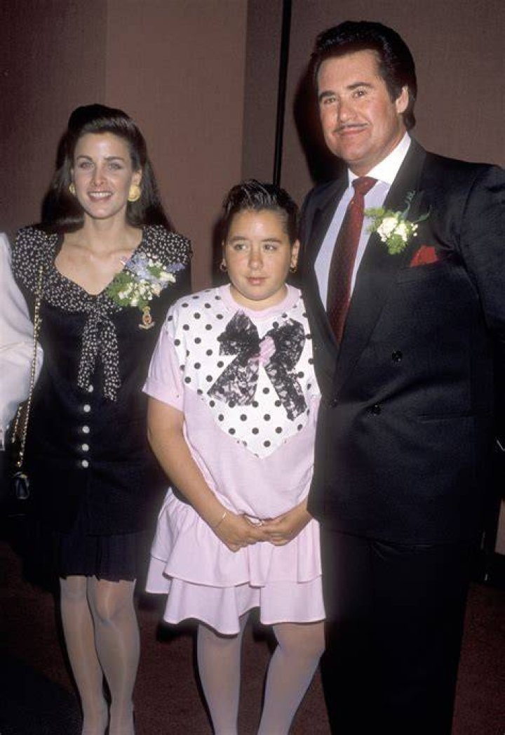 Wayne Newton and his wife Kat Newton holding their newborn son, Carson
